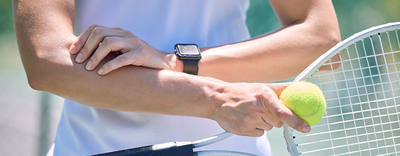 patient suffering from tennis elbow in need of chiropractor in Santa Rosa